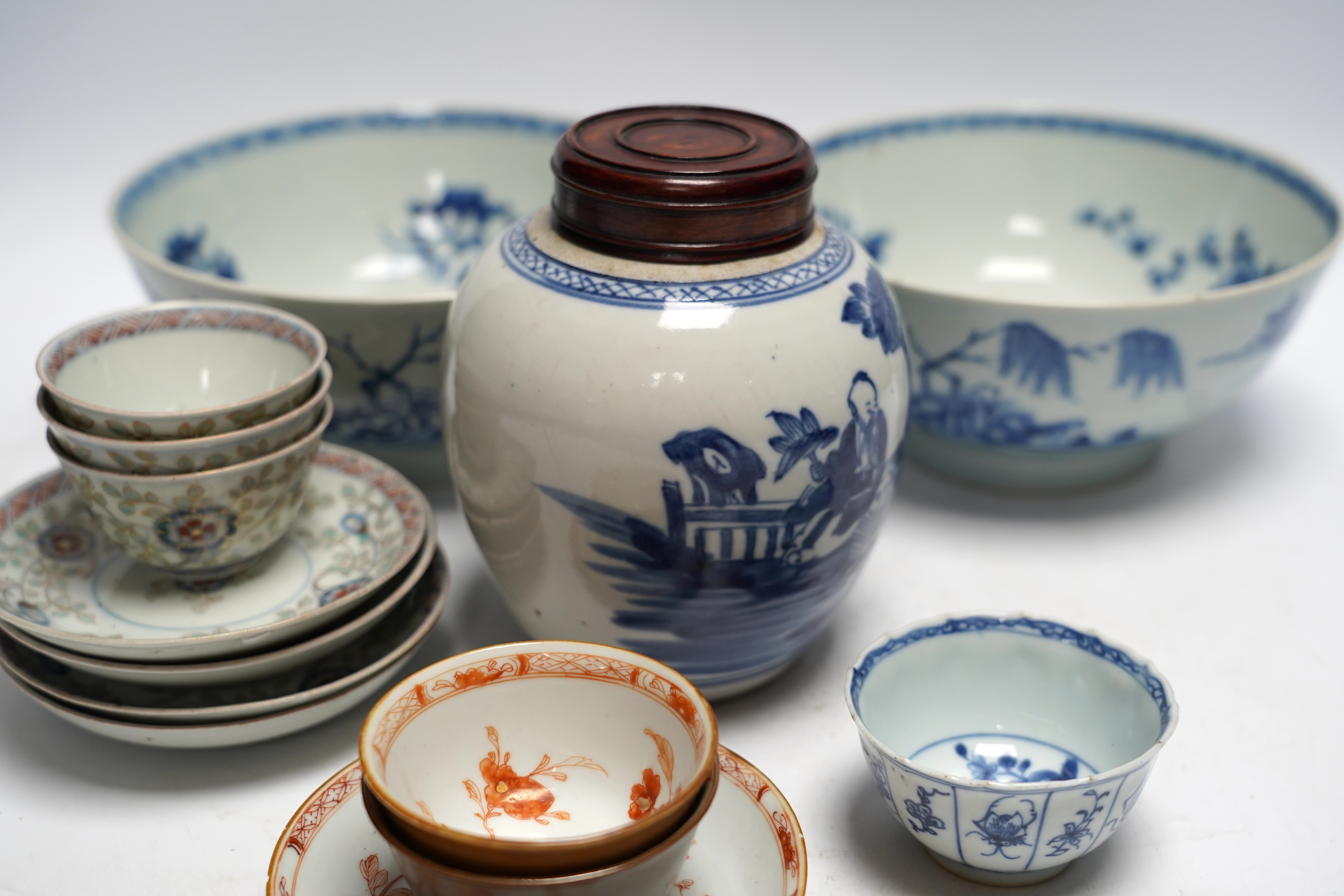 A group of 18th century Chinese and Japanese porcelain including blue and white bowls and jar with hardwood cover, largest 19cm in diameter